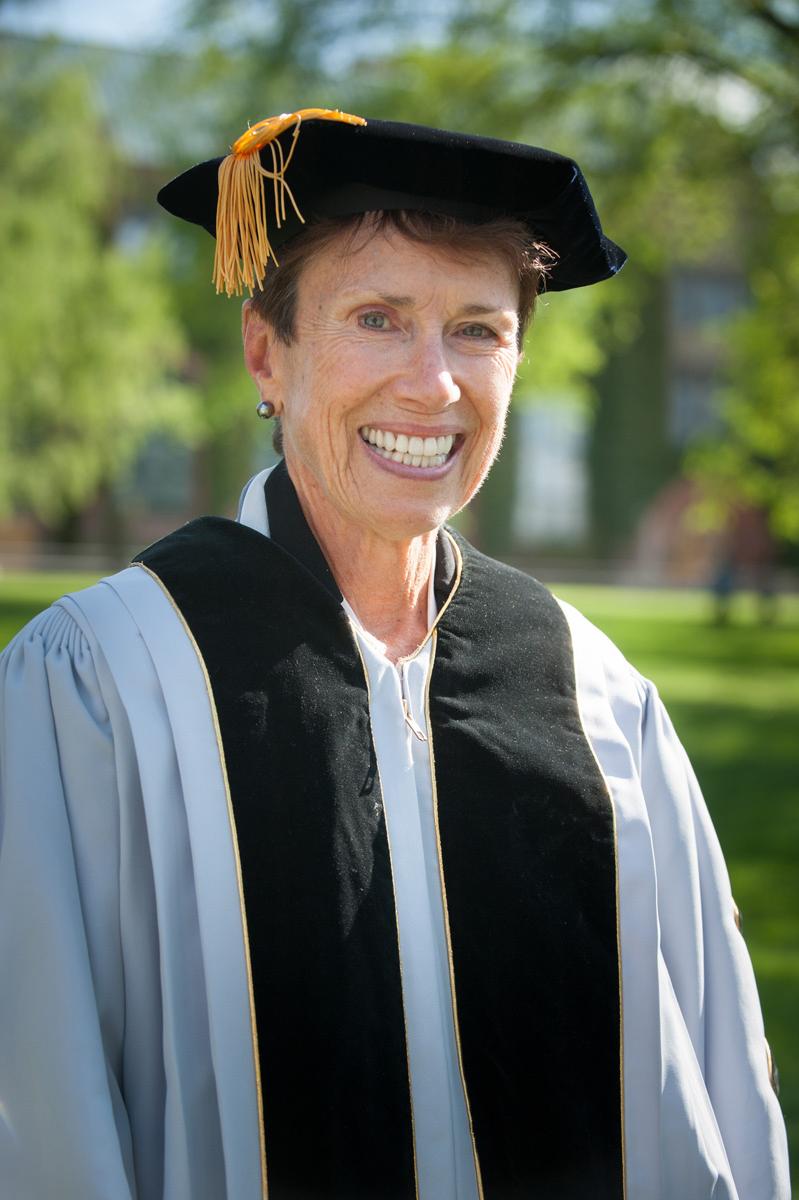 Judith Runstad wearing commencement robes on the Admin Lawn.